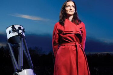 Sara Seager with a telescope in her yard