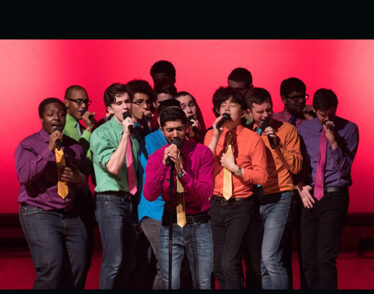 Photo showing MIT senior Shaun Datta, at center performing with his fellow MIT Logarhythms.