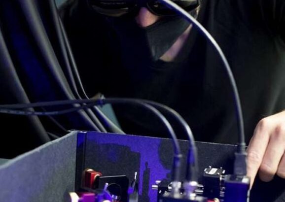 Researcher looks at 420 mm laser.
