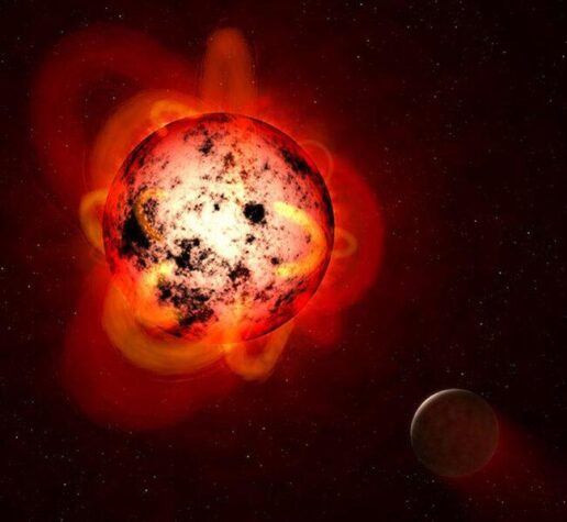 An illustration of a red dwarf star orbited by an exoplanet.