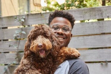 Headshot of Renaldo Webb and dog