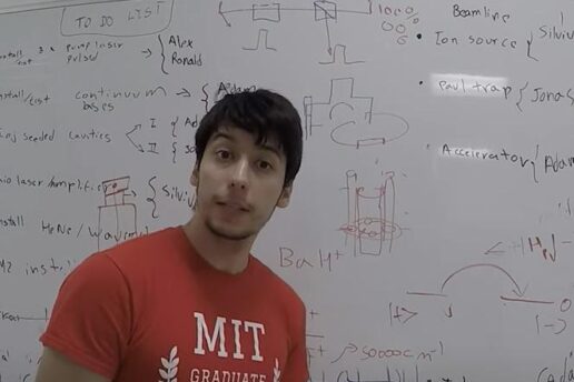 Alex Brinson raps in front of white board full of calculations