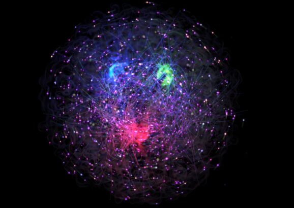 An illustration of the proton with red, blue, and green quarks and lines