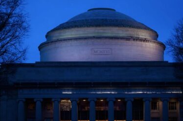 An image at night of the Great Dome on the MIT campus