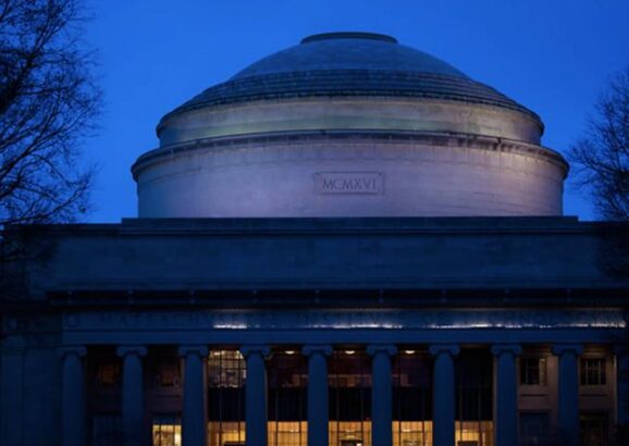 An image at night of the Great Dome on the MIT campus