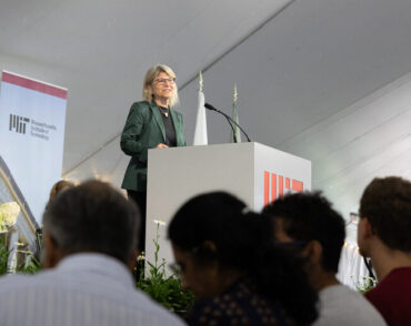 Sally Kornbluth speaking at a podium