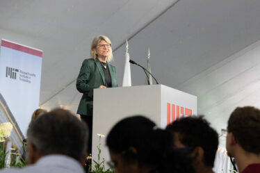 Sally Kornbluth speaking at a podium