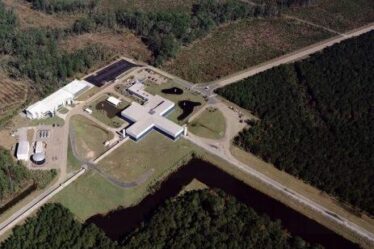 An aerial view of the Virgo site shows the Mode-Cleaner building, the Central building, the 3km-long west arm and the beginning of the north arm.