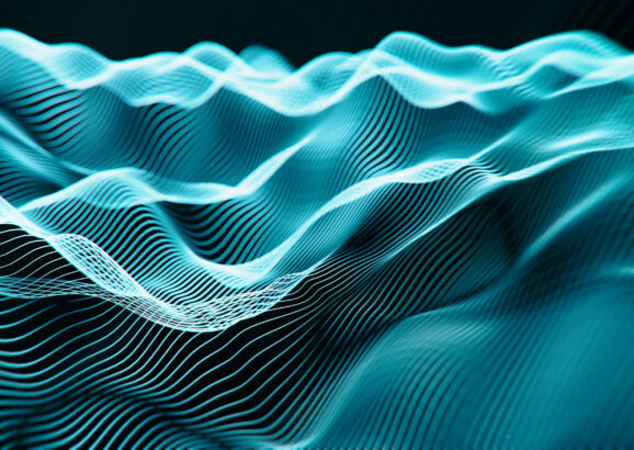 Waves of blue lines on a black background