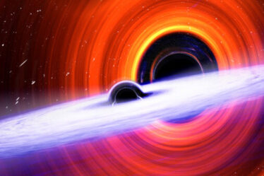 Two black holes with misaligned accretion disks on the cusp of merging