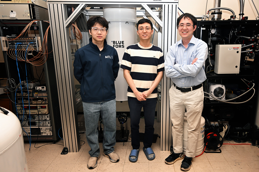 Researchers Shenyong Ye, Junseok Seo, and Long Ju pose in lab