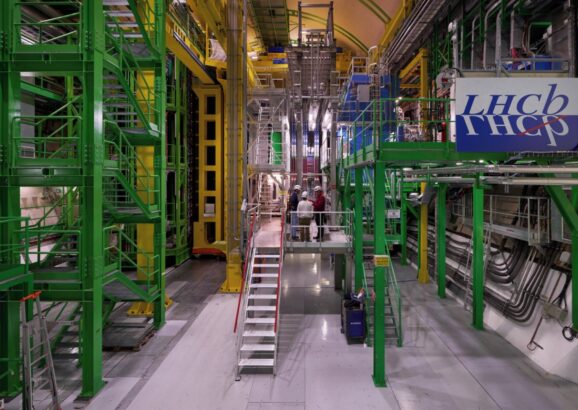 Image of the The LHCb experiment, a large assemblage of metal scaffolding and pipes in bright colors