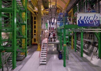 Image of the The LHCb experiment, a large assemblage of metal scaffolding and pipes in bright colors