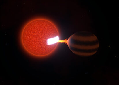 A red sphere, left, sucks energy out of a brown sphere, causing a patch on the red sphere to glow white hot.